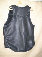  This is a picture of the back of the vest that better shows its yoke and the 3" curved draft flap. 