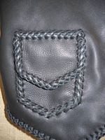  A close up view of the patch hip pocket. The vest also has inside pockets using the same braiding as this outside one uses. 