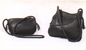 purses that are braided and have long braided leather shoulder straps and zipper closures