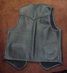  Here is a picture of the back of the vest with a better view of its pointd back yoke. 