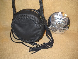  This purse was made to attach that Harley Davidson air cleaner cover on. I think it's a nice style without the cover. The braided strap is quite long ...for being worn cross body - over ones head/shoulder. 