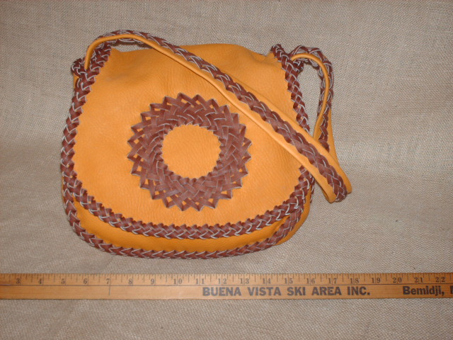 custom and handmade braided leather purse. 