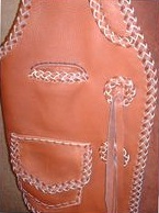  this vest has braided leather conchoes with straps 