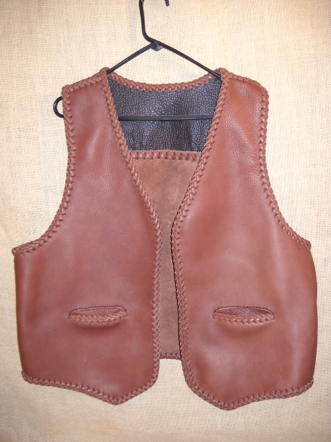  two tone (smooth side out) leather vest with a (suede side out) straight back yoke and slit pockets  