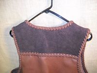  a closer look at the (suede side out) darker brown back yoke of this two tone vest 