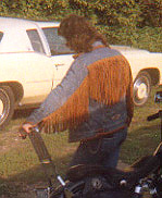 denim jacket with braided leather fringe