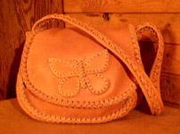  These purse have two compartments under the flap. This one has my butterfly applique on the flap. 
