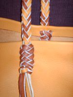  This is a close up picture of one of the strap attachments ...that is also braided. 