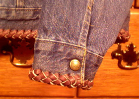 denim jacket with braided leather sleeve cuff