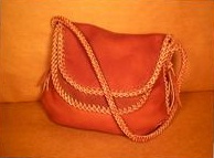  Two more pictures of one of these large shoulder bags. This one made with the Rust color 4 oz. moccasin cowhide leather. 