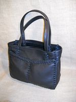 This Black tote was also built using the basic construction of this style - two front pockets, a back inside pocket, and flat straps. 