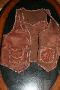  The picture shows the front of the vest with one side folded over so you can see that its two pockets also have two more pockets on the inside of the vest - I do this with many of the patch pockets on my products. 